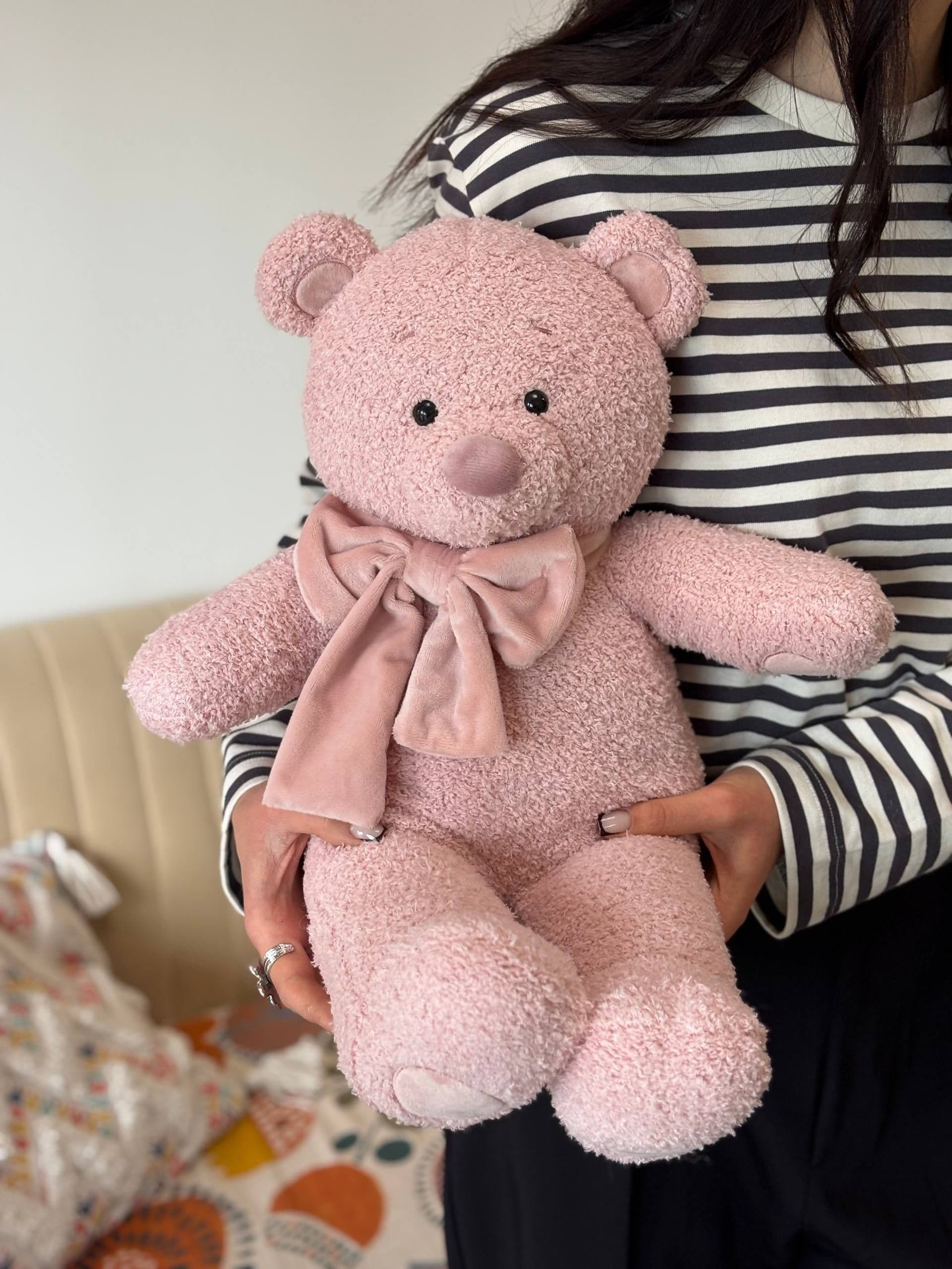 "Powder-colored Cody with a bow" plush toy