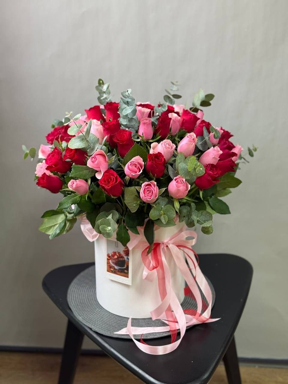 Roses in a box "57 mix with eucalyptus"